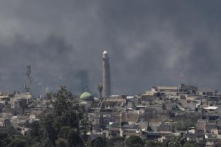 Smoke rising above al-Nuri mosque