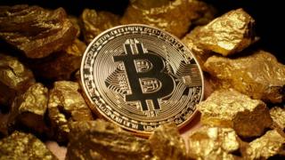 Bitcoin and a pile of gold