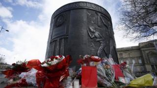 Floral tributes left at a Hillsborough memorial in Old Haymarket, Liverpool,