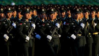 Chinese People"s Liberation Army troops practice marching as they arrive at Tiananmen Gate for a military parade to commemorate the 70th anniversary of the end of the World War II in Beijing Thursday Sept. 3, 2015