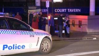 Police speak with witnesses after the violent altercation