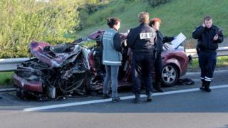 Police inspect the site of an accident on the A16 motorway in Coudekerque, near Dunkerque, northern France, on May 5, 201