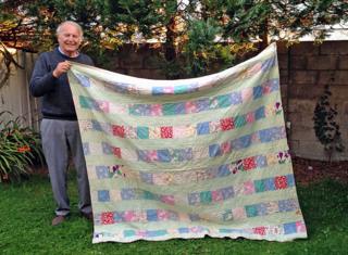 Joseph Briddock with his quilt