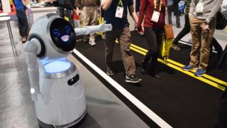Cruzr service robot greets exhibition goers during CES 2018 at the Las Vegas Convention in Las Vegas on January 12, 2018.