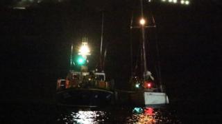 Douglas RNLI lifeboat returning to harbour with casualty vessel
