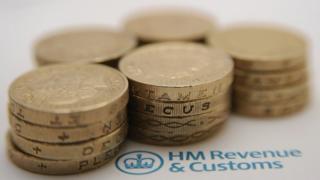 Pound coins by HMRC logo