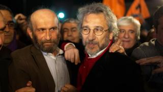 Can Dundar (R), the opposition Cumhuriyet daily"s editor-in-chief and Erdem Gul (L),Cumhuriyet daily"s Ankara bureau chief talk to the press after being freed from Silivri prison in Istanbul on February 26,2016