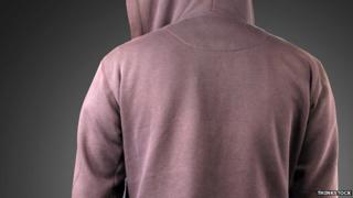 Person in hoodie photographed from behind
