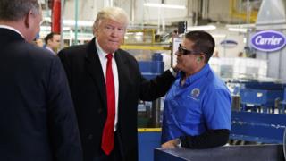 President-elect Donald Trump talks with workers during a visit to the Carrier factory, Thursday, Dec. 1, 2016, in Indianapolis, Ind