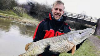 Jon Burton with pike