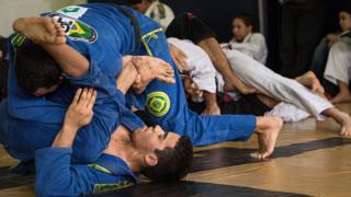 Brazilian jiu-jitsu fighters grappling
