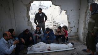 Relatives mourn 15-year-old Ziad Rihani, who was killed by shellfire in the besieged rebel-held Douma district of Damascus, Syria (14 November 2016)