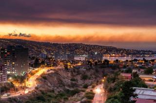 Smoke billows from the forest around Valparaiso, in Chile