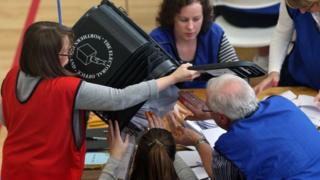 Count staff empty a ballot box