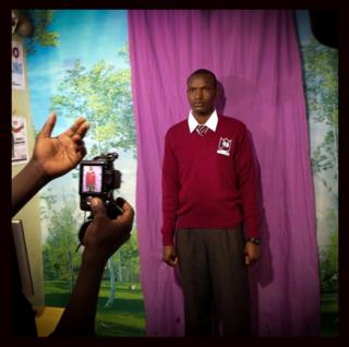 A student poses for a school photo