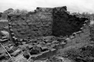 A mud brick house destroyed by heavy rainfall and flooding