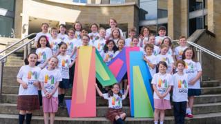 Pupils on concert hall steps