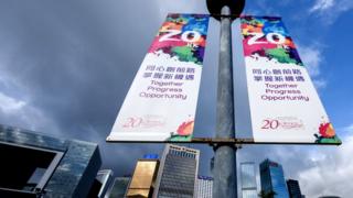 Banners marking 20 years since the handover