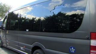 A damaged window on the bus