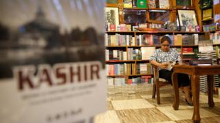 A girl reads a book in the Gulshan Books cafe