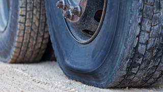 A flat tyre on a lorry
