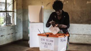 A Zambian woman gets ready to cast her ballot for the Zambian Presidential elections at Kanyama primary in Lusaka on January 20, 2015