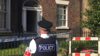 Policeman outside the house in Falkner Street