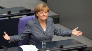 German Chancellor Angela Merkel speaks during a special meeting at the Bundestag in Berlin, Germany, 19 August 2015