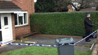 Police officer outside the house in Llanrumney