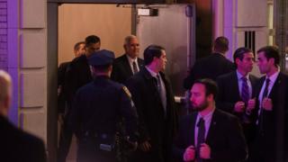 Vice President-elect Mike Pence, top centre, leaves the Richard Rodgers Theatre after a performance of "Hamilton," in New York, Friday, Nov. 18, 2016.