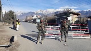 Pakistani soldiers stand guard at a checkpoint in Parachinar, capital of the Kurram tribal district, on 22 January 2017