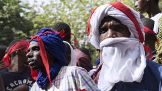 Young Fulanis listen to a declaration during a demonstration in Bamako on March 15, 2018 organized by the Jeunesse Tabital Pulaaku-Mali, the youth chapter of an organization dedicated to preserving the rights of Mali"s Fulani people, who have become victims of retaliatory violence after being accused of attacks against farmers in central Nigeria"s Plateau state.