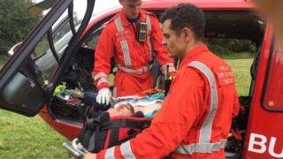 Kieron Robbins being taken to hospital