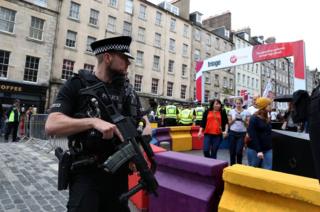 Armed officer at Fringe
