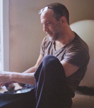Michael Van Huffel in his apartment