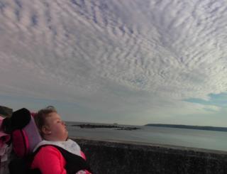 Girl looking out to sea