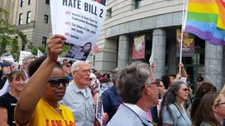 Protesters march to show their opposition against what they called 'Hate Bill 2', which they urged lawmakers to repeal as legislators convened for a short session in Raleigh, North Carolina April 25, 2016