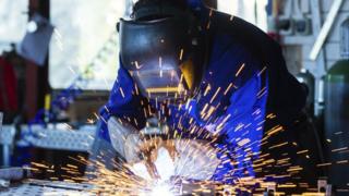 Welder with sparks flying