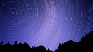 Time exposure photograph of polar stars during a meteor shower