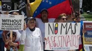 Supporters of the Venezuelan opposition demonstrate in front of the Organization of American States (OAS) headquarters in Washington, DC, on May 31, 2017 ahead of a meeting of Foreign Ministers of the OAS to discuss the situation in Venezuela.