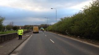 Police on the scene of the accident at Balmore Road
