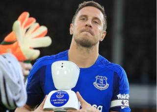 Phil Jagielka and the robot mascot