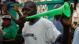 People celebrate the victory of Julius Maada Bio as new president of Sierra Leone on April 4, 2018 in Freetown, Sierra Leone.