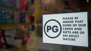 PG sign in window of Scribbler store