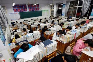 This photo taken on 24 May 2016 shows senior high school students studying at night to prepare for the college entrance exams at a high school in Lianyungang, east China's Jiangsu province.