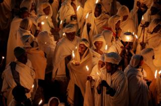 Ethiopian Orthodox pilgrims attend Christmas Eve celebration.