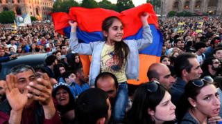 Supporters of Armenia's protest leader Nikol Pashinyan attend a rally in downtown Yerevan on April 26, 2018