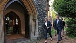 Theresa May and her husband Philip attending a church service in her constituency