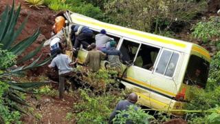 People try to rescue survivors after the bus crash in northern Tanzania. Photo: 6 May 2017