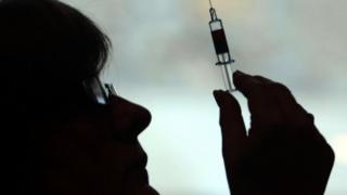 File photo dated 05/10/09 of a nurse preparing a syringe